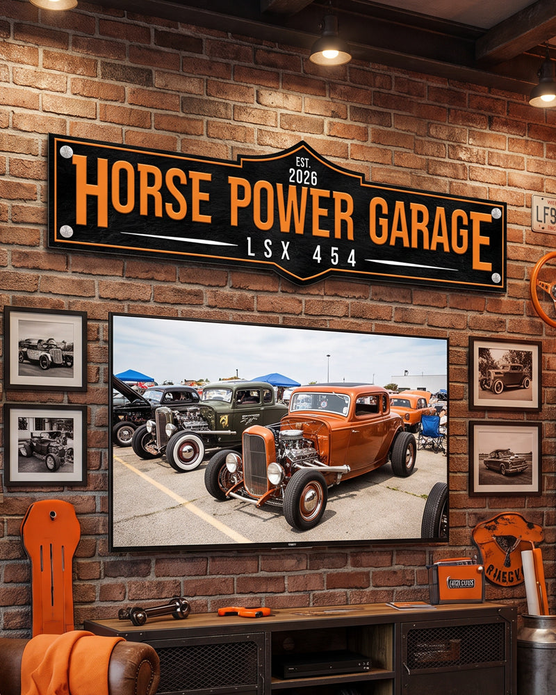 Custom garage man cave sign on a brick wall above a TV framed by hot rod photos