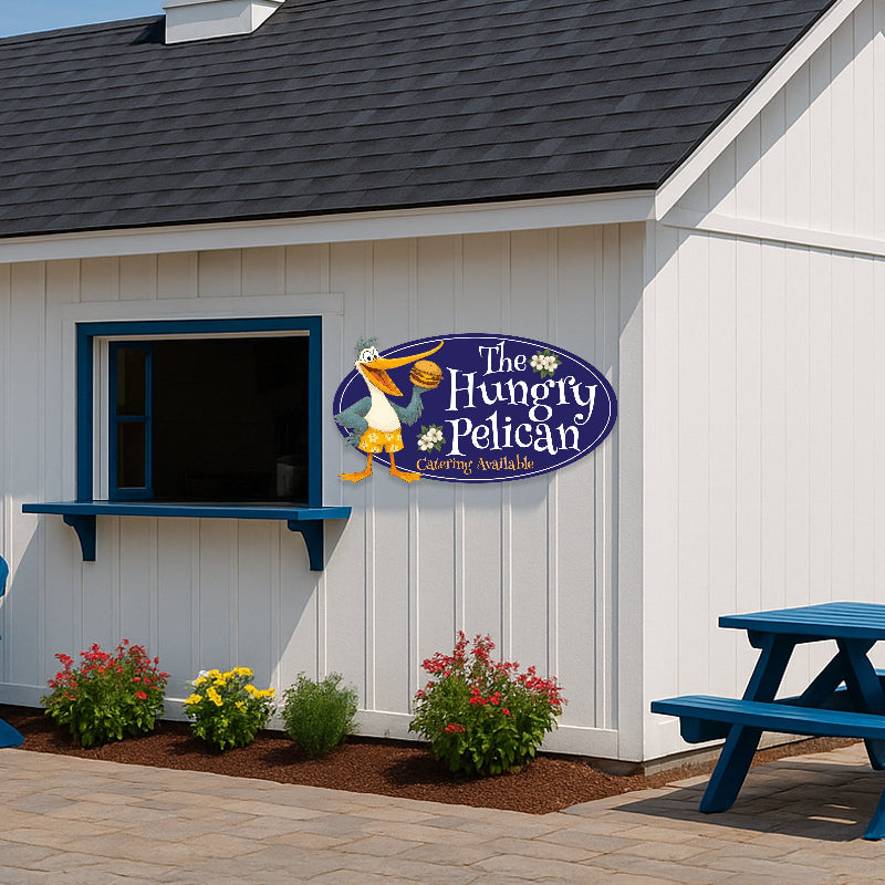Custom sign for a restaurant, The Hungry Pelican business sign on a white building