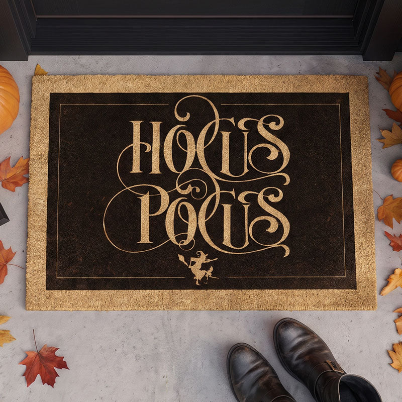 Hocus Pocus halloween door mat at dark door threshold with fall leaves and witch boots