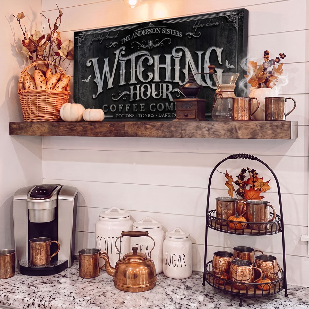 Witching Hour coffee sign on a floating shelf above a coffee maker with copper mugs, canisters and autumn styling