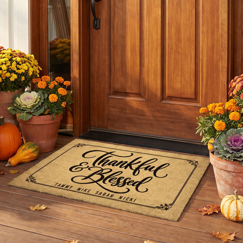 Thankful and Blessed fall doormat with multiple family names on golden coir