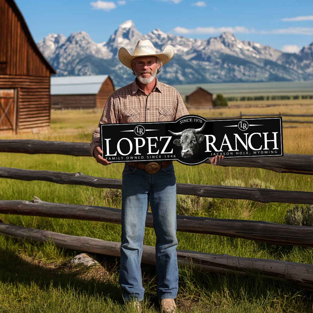 farm entrance signs with black textured background and a man holding a sign that has a cow on it.