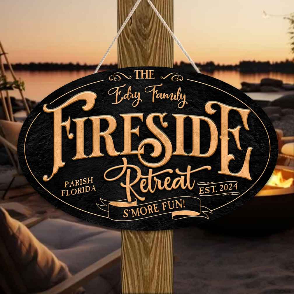 firepit sign oval with black textured background with (Family Name) and the words Fireside Retreat.