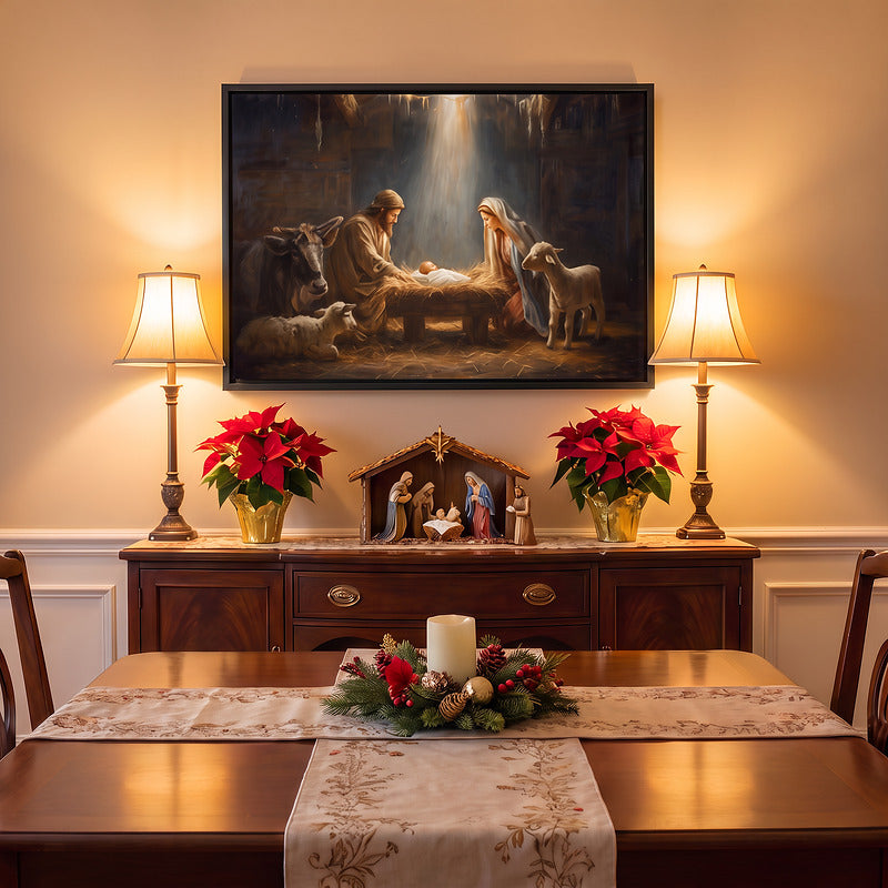 Nativity canvas in a black frame above a mahogany sideboard between two lamps, with poinsettias and a nativity set