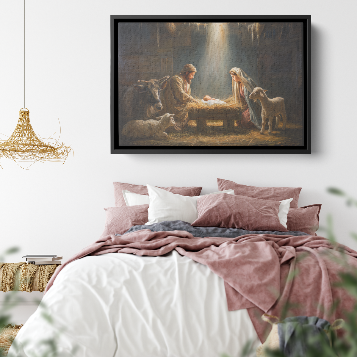 Nativity canvas in a black frame above a bed with dusty pink velvet pillows and a woven pendant lamp