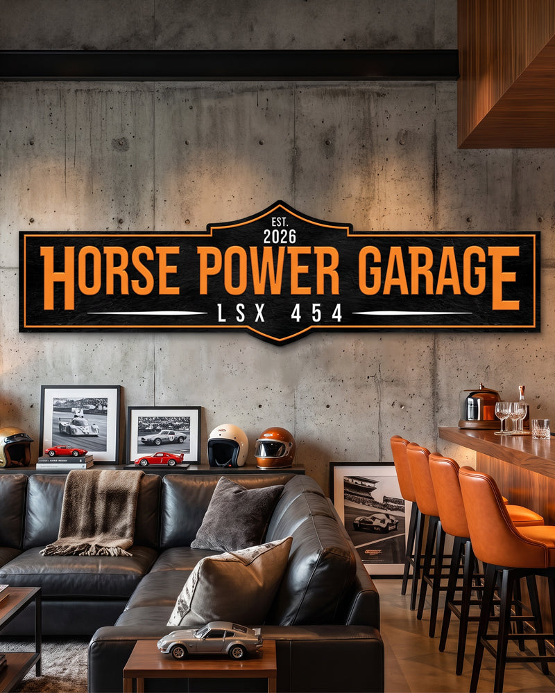 Personalized garage man cave sign in orange and black above a leather sectional and bar stools in a man cave