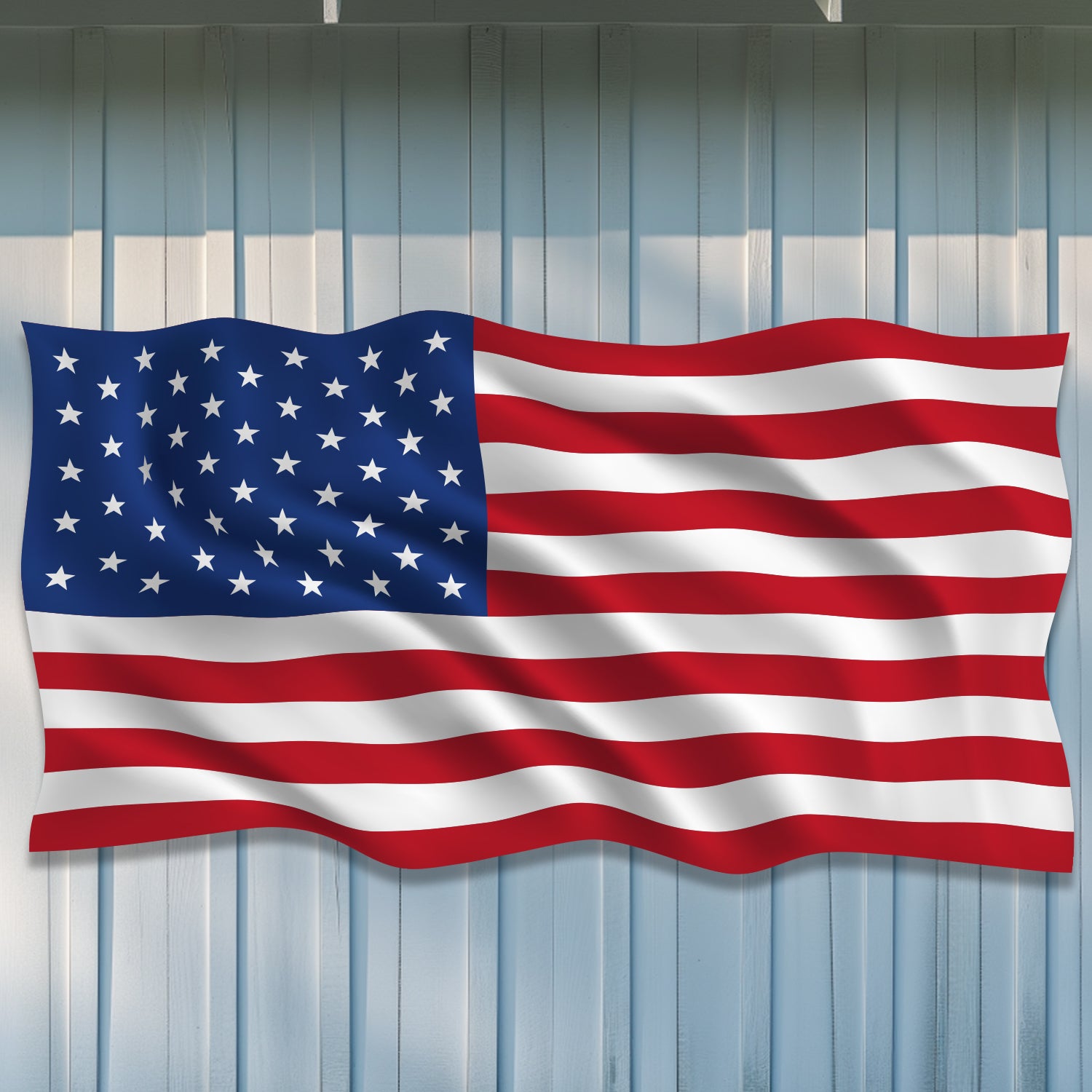 Large American Flag on white barn
