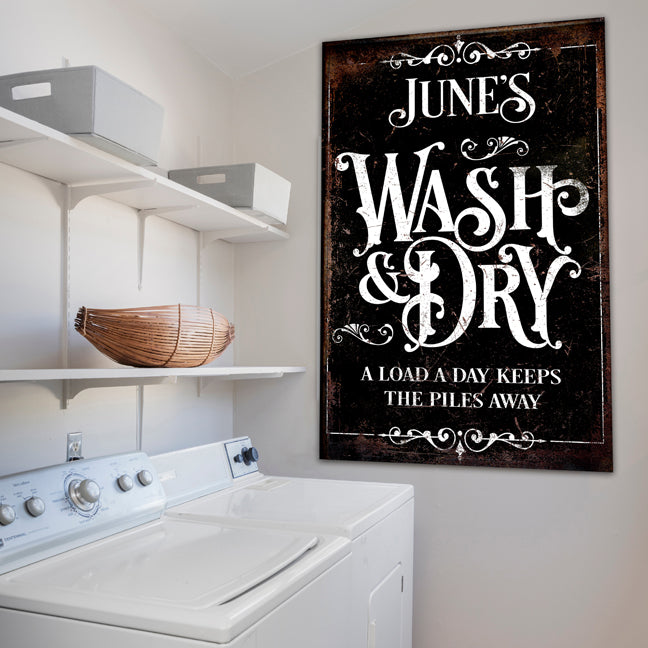 Laundry room decor sign personalized with a distressed background and family name.