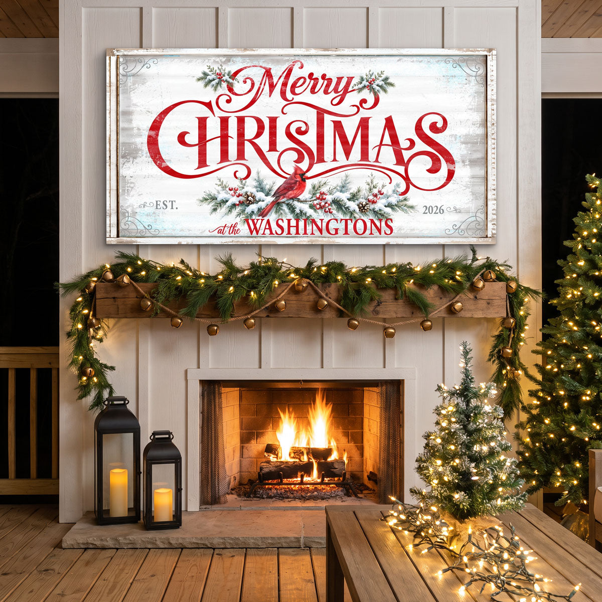 Family name Merry Christmas sign above a lit fireplace with a bell garland, lanterns and a flocked tree