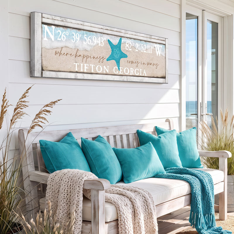 metal beach house sign on the porch of a beach house