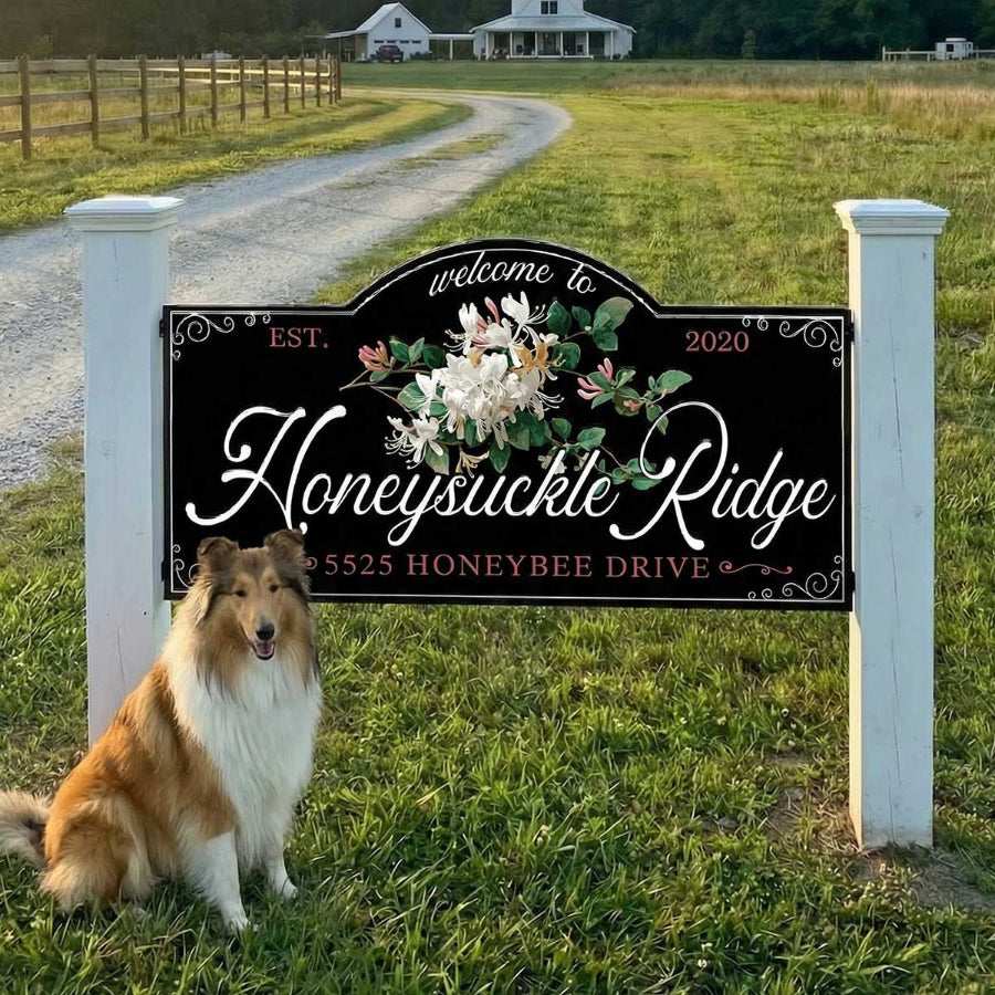 metal Farm sign with address and dog sitting by it.