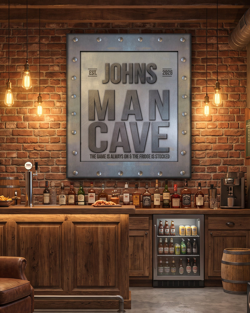 Metal man cave sign over a home basement bar with brick wall, edison bulbs and a beverage fridge