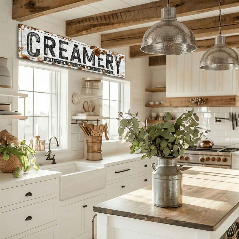 modern farmhouse decor of a creamery sign over the kitchen sink.