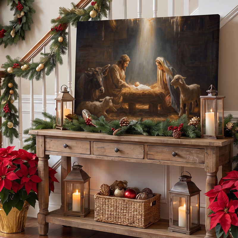 Nativity wall art canvas on a rustic console in an entryway, with lanterns, candles and garland by a staircase