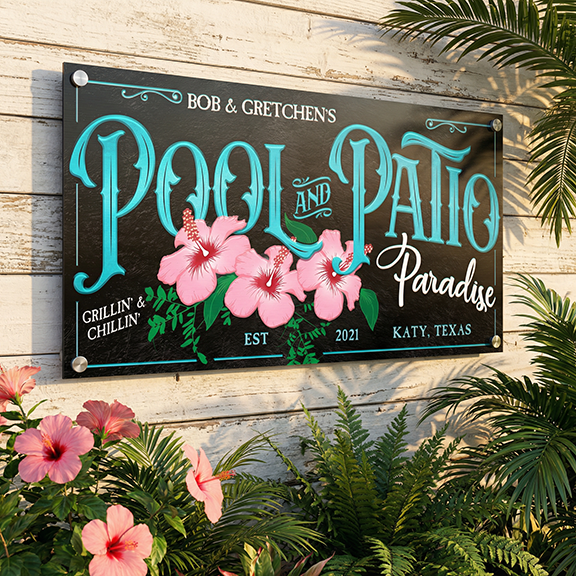 outdoor pool decor sign that says Pool and Patio in black and teal with pink hibiscus flowers.