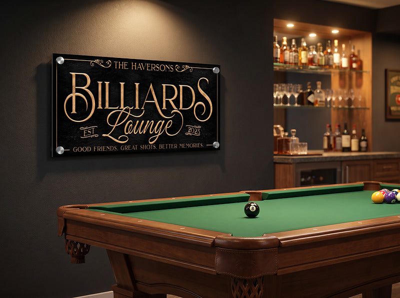 Personalized billiards sign with standoff mounting hardware on a dark wall beside a whiskey shelf and pool table