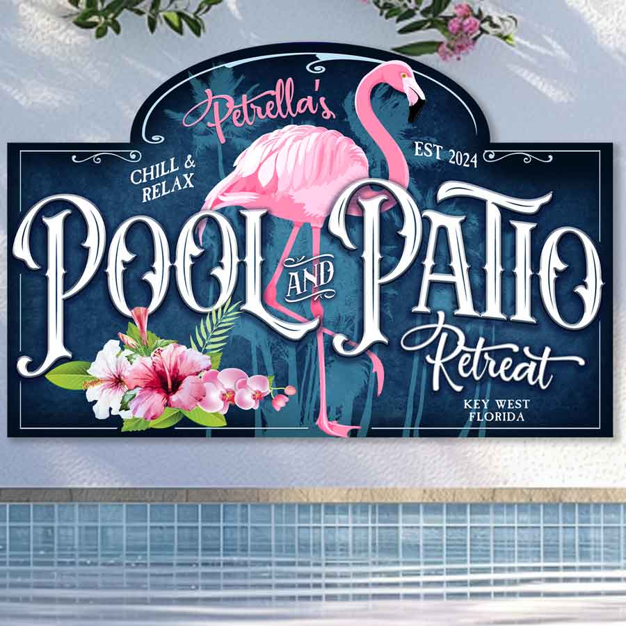 personalized pool sign with blue background and a pink flamingo and the words - (family name) Pool and Patio