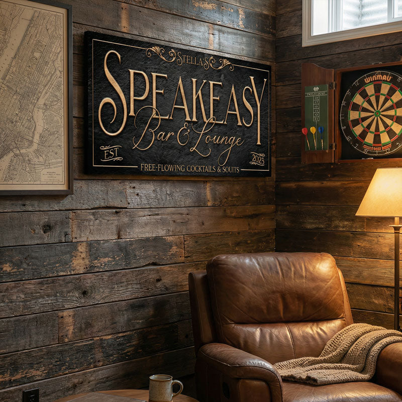 speakeasy personalized canvas sign mounted to a wooden wall with chair in front.