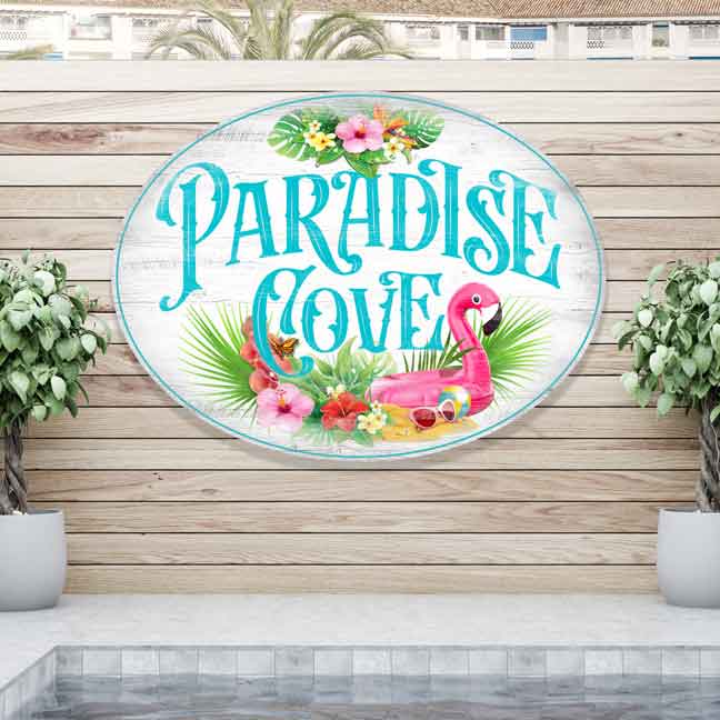 pool sign with rough worn wood look with tropical flowers and flamingo floatie with the words Paradise Cove