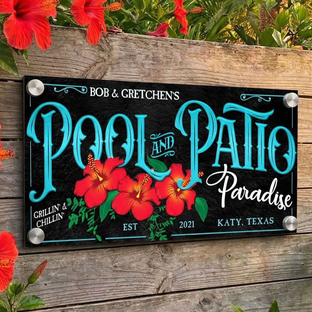 pool decor ideas of a pool sign on a wooden fence with red hibiscu flowers
