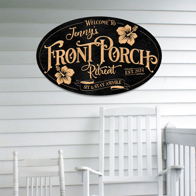 Metal front porch welcome sign on black textured background in the shape of a oval personalized