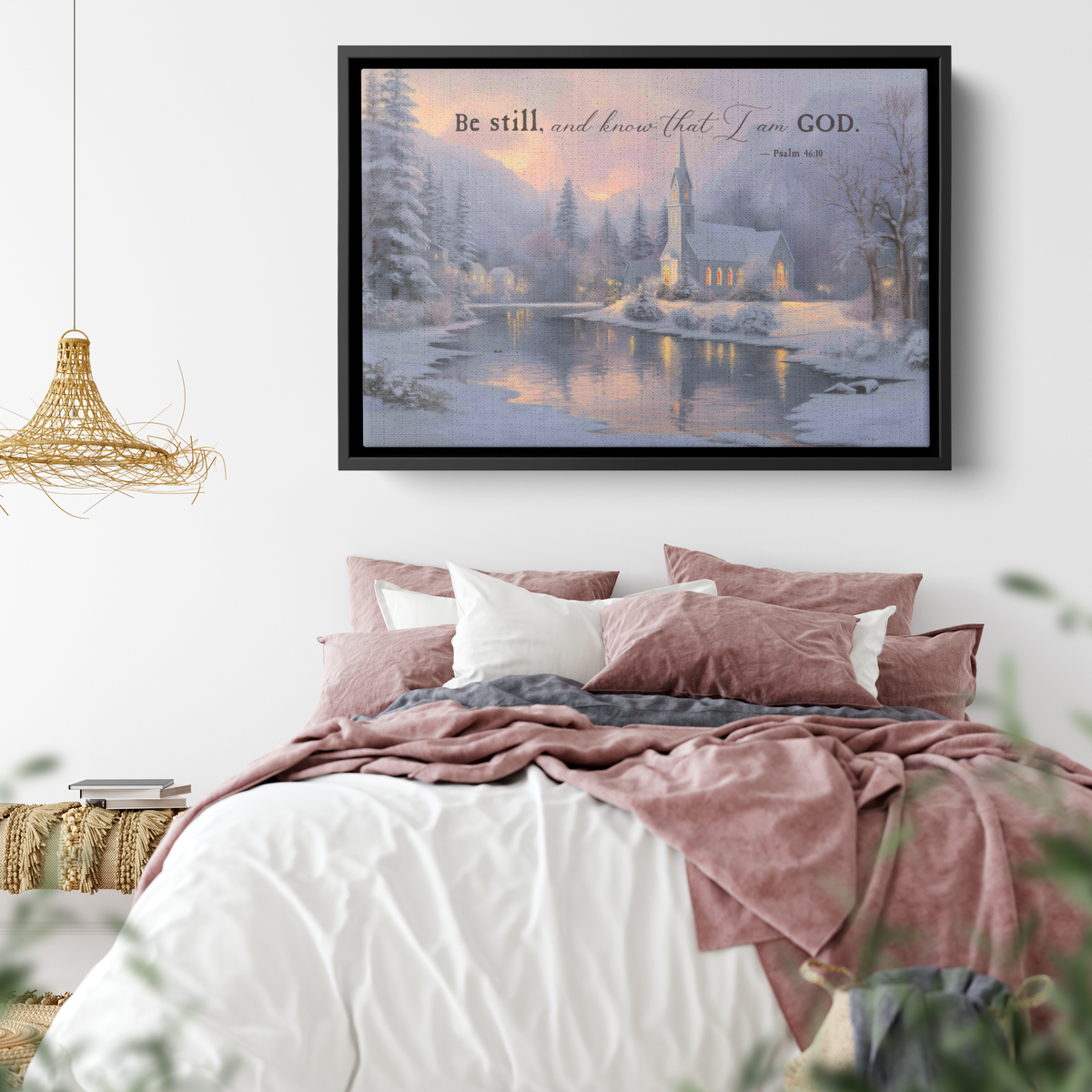 Religious wall art canvas of a snowy church hung above furniture in a warm room