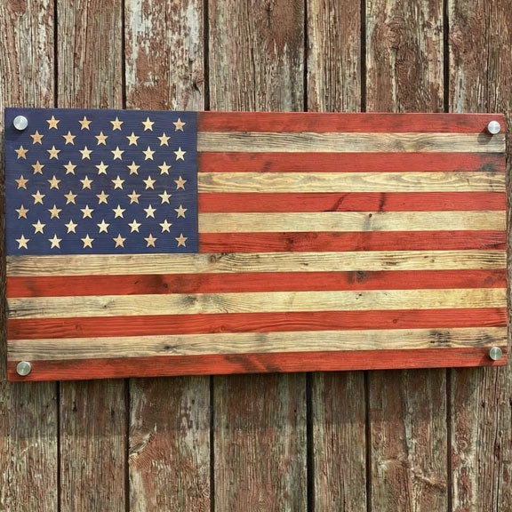 rustic american flag with wood look, made of metal on a old wood barn