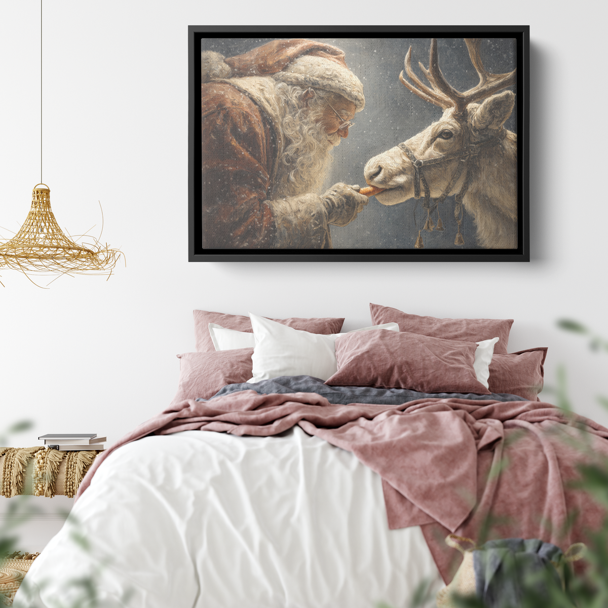Old world Santa and reindeer canvas in a black frame above a bed with dusty pink bedding and a woven pendant lamp
