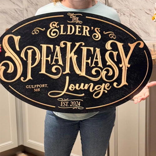 Person holding a speakeasy bar signs in a review.