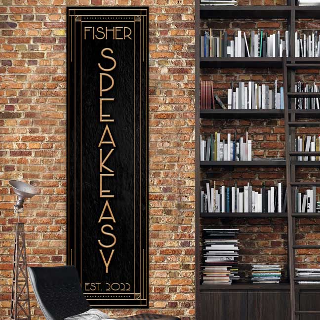 speakeasy wall decor vertical on black textured background with gold art decor style letters.