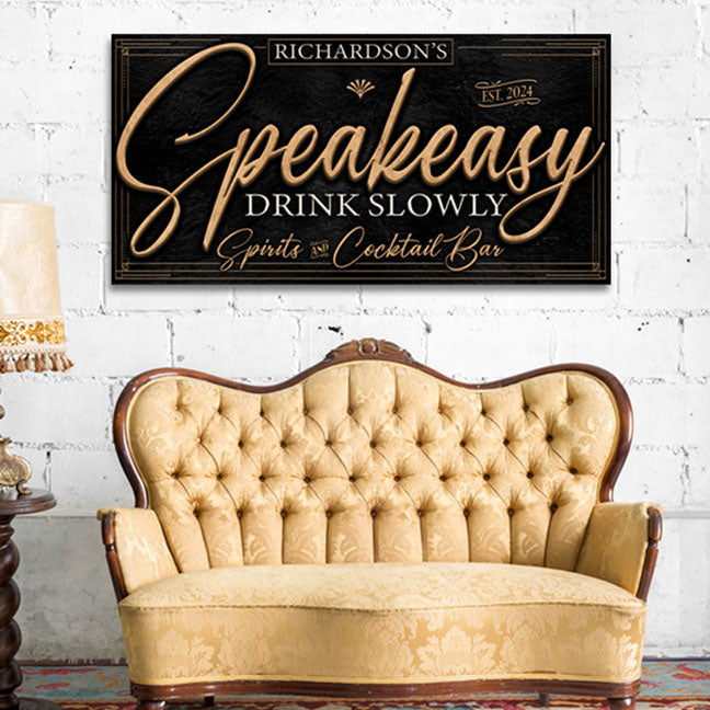 speakeasy sign decor on gold script letters with the words Speakeasy - drink slowly spirits and cocktails