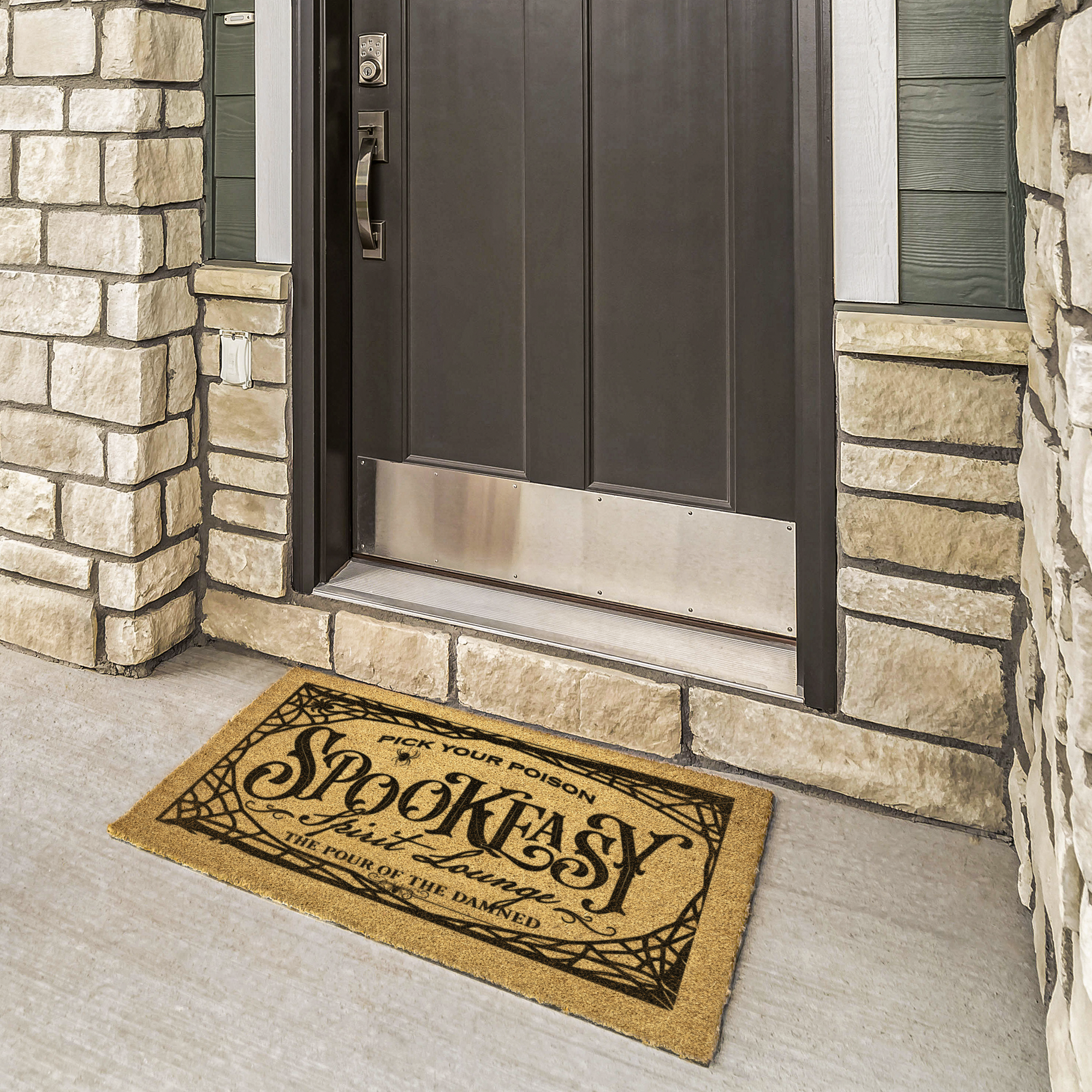 Spookeasy Spirit Lounge mat reading The Pour of the Damned at a bronze door framed by cream stone
