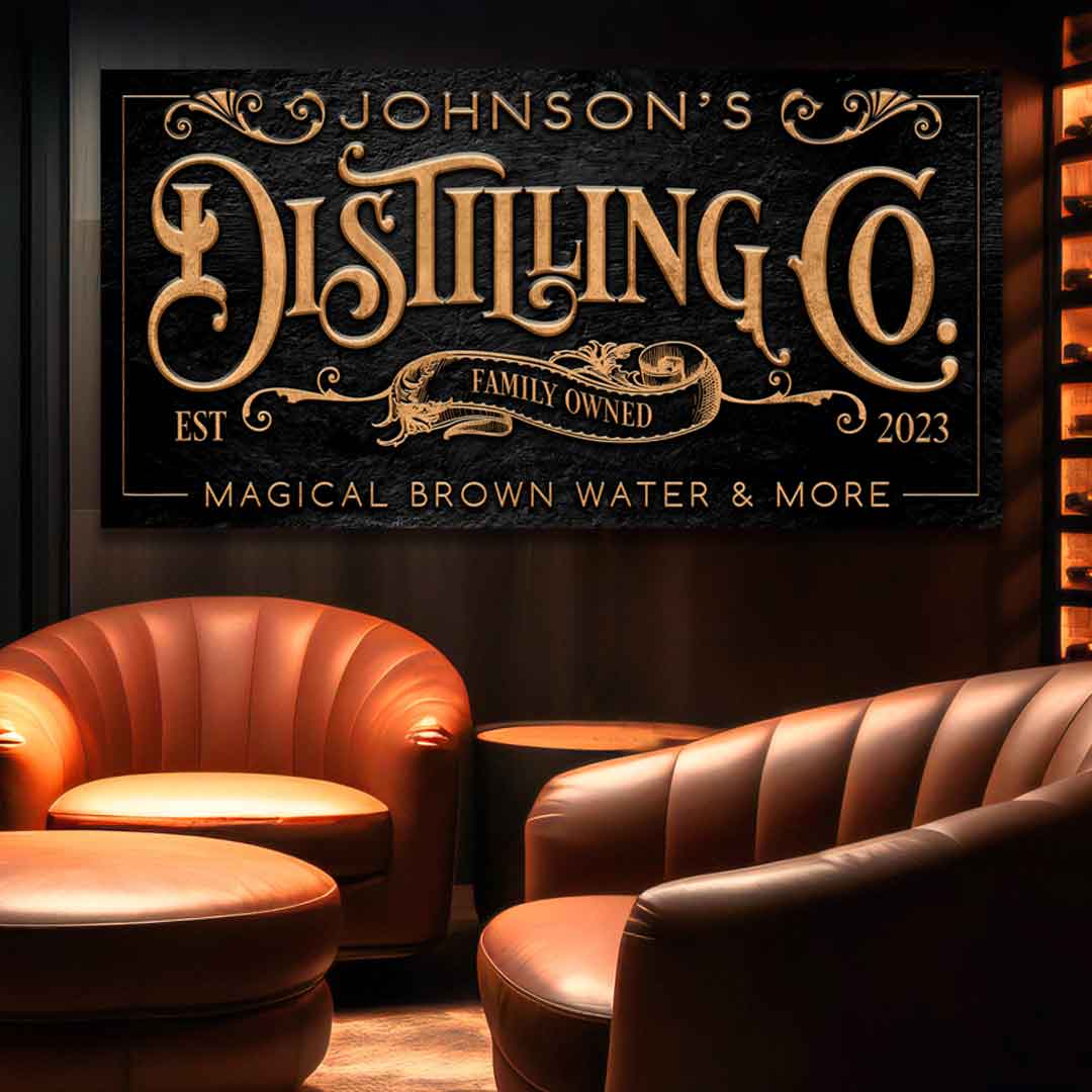 Tailor Made Distilling Co. sign with gold letters on Black stone that says Distilling Co.