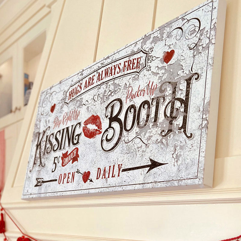valentines wall decor sign kissing booth on a kitchen hood vent.