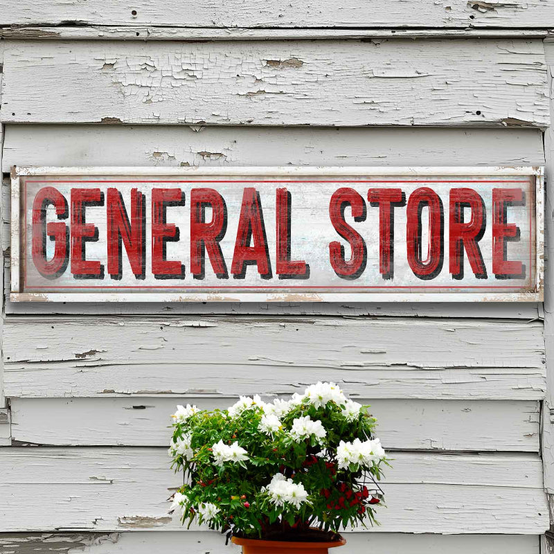 vintage general store sign with red letters and white faux wood background