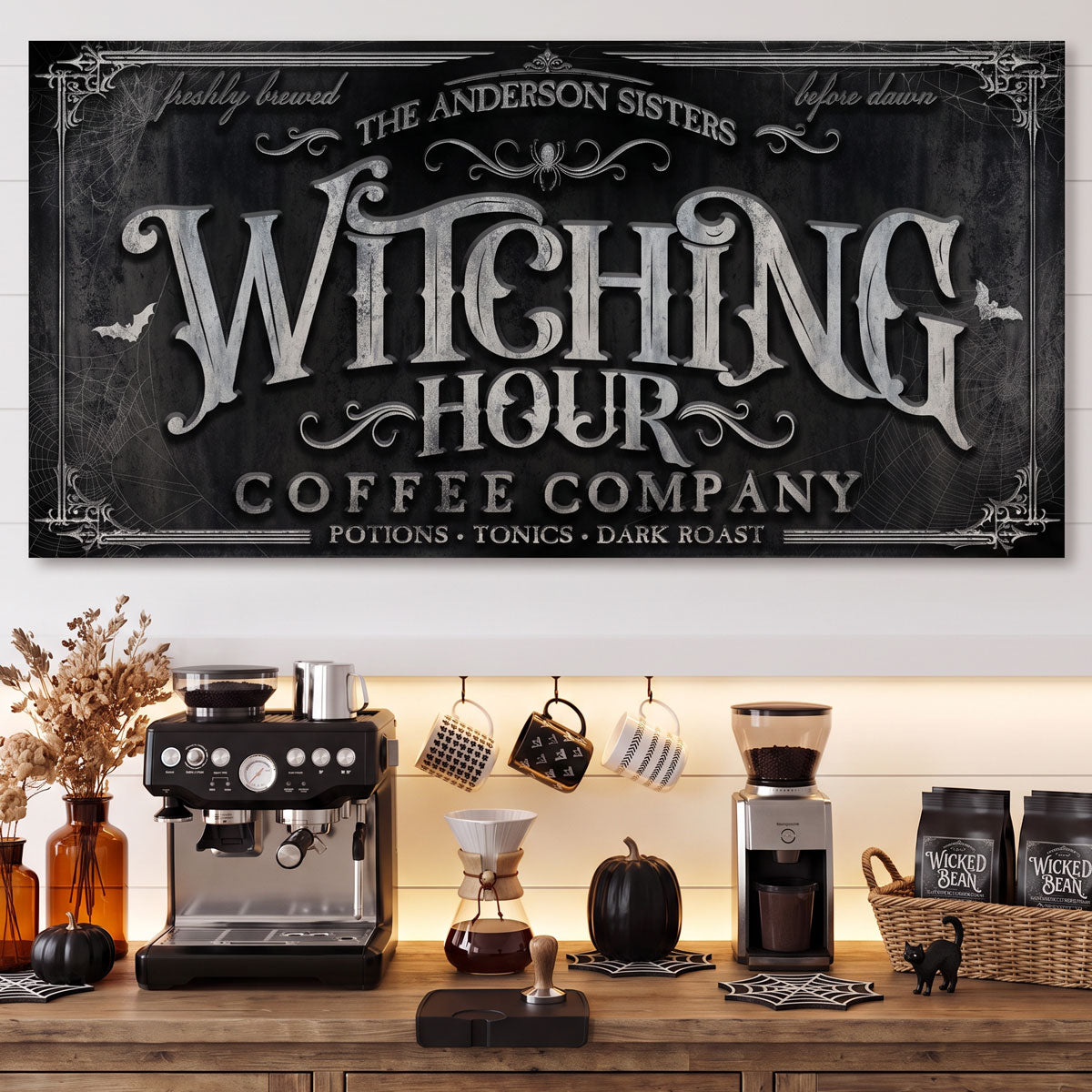 Witching Hour coffee sign above an espresso machine, grinder and hanging mugs on a wood coffee counter