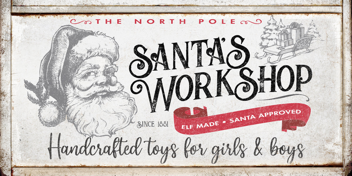 Santa's Workshop Christmas Wall Art sign with the words [The North Pole Santa's Workshop - Handcrafted toys for girls & boys] on antique faux wood frame