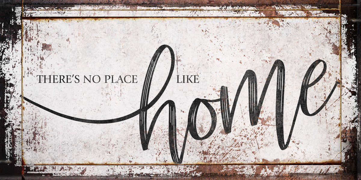 Modern farmhouse wall decor of distressed wood and the words: There's no place like Home