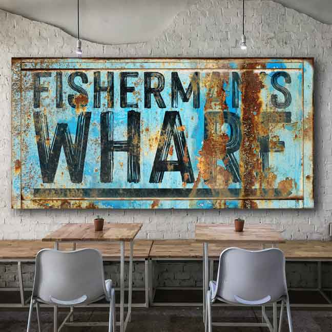 Beach House Decor -Coastal Decor, restaurant decor of distress blue rusty metal sign with the words: Fisherman's Wharf with an arrow.