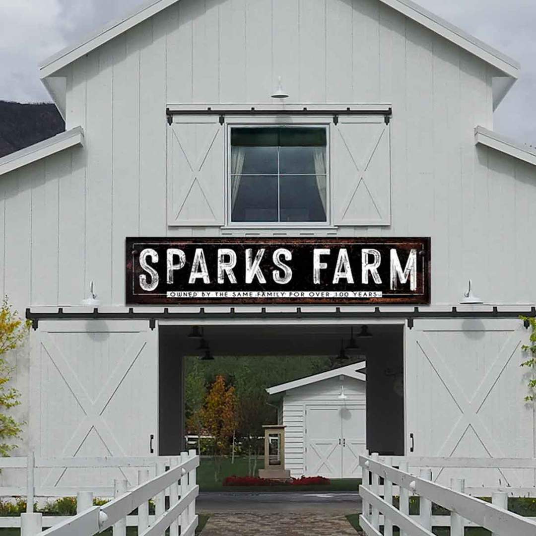 BARN SIGN_Large Metal Farmhouse Signs with Family Name, on black rustic metal, with Family Name on it it with a white outline.