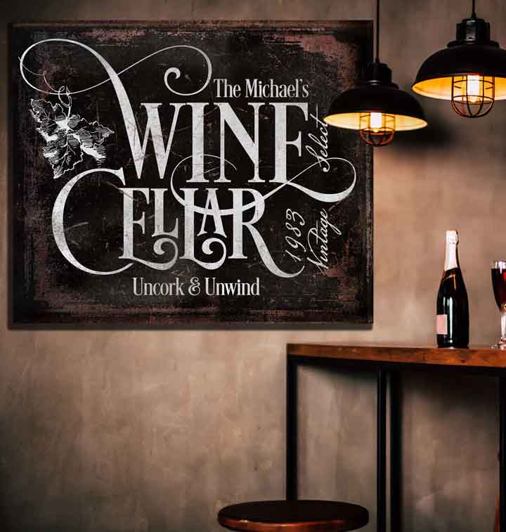 Wine Cellar Decor Art on black distressed frame with white lettering that say [Family Name] Wine Cellar, Uncork and Unwind, with date.