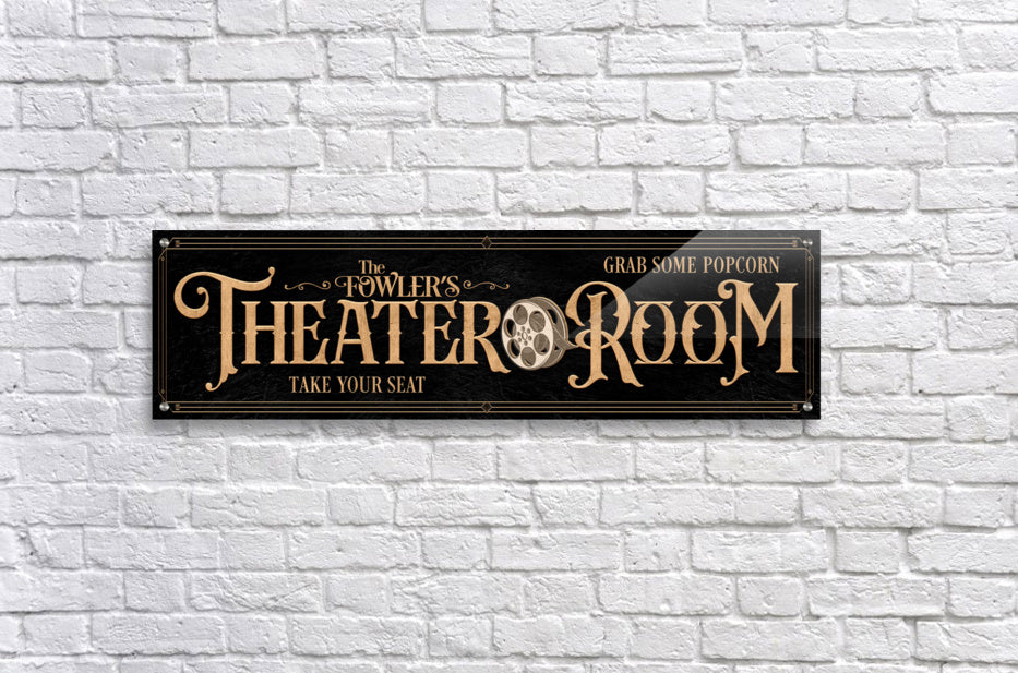 Personalized Theater Room Sign in Gold lettering on black textured background, with a movie reel and family name