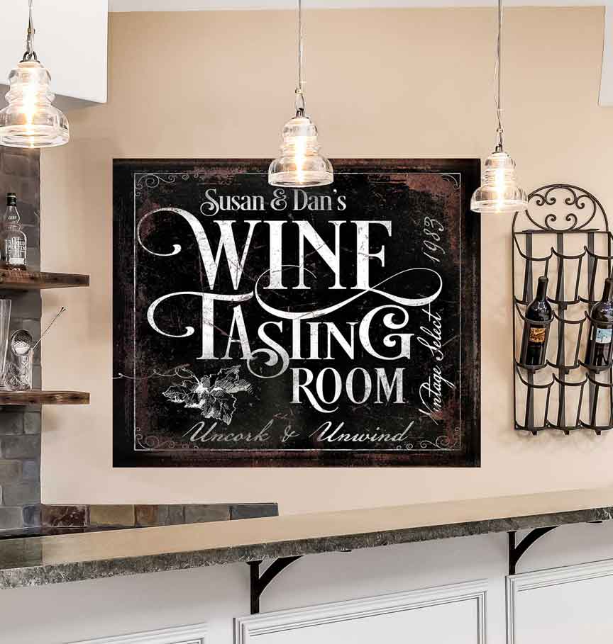 Wine Tasting Bar Sign on distressed black canvas, with [family name] and the words Wine Tasting Room right next to the wall wine rack
